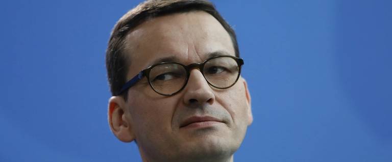 Polish Prime Minister Mateusz Morawiecki listens during joint press conference with Germany Chancellor at the Chancellery on February 16, 2018 in Berlin, Germany.