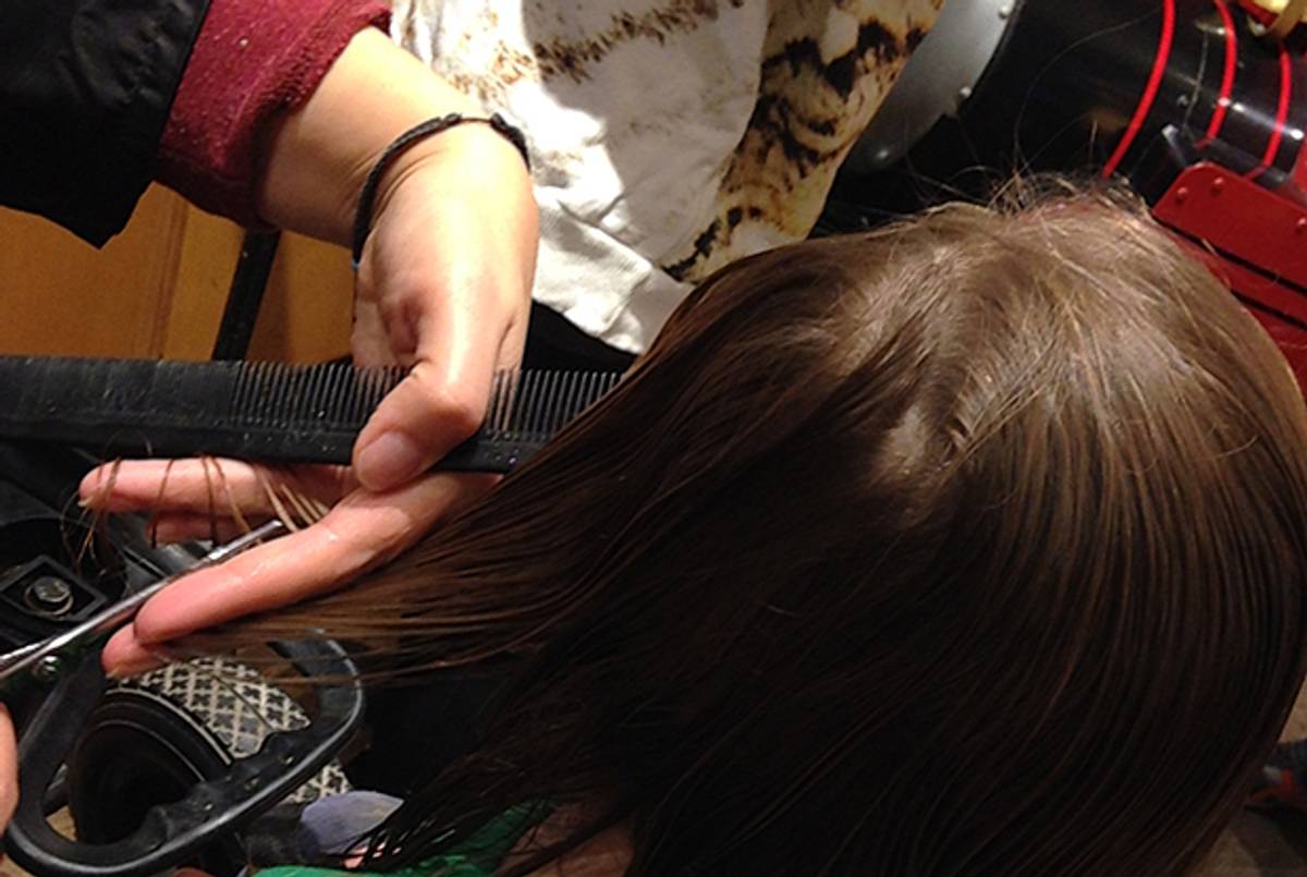 The author's son gets his first haircut. (Photo courtesy of the author)