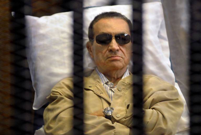 Ousted Egyptian president Hosni Mubarak sits inside a cage in a courtroom during his verdict hearing in Cairo on June 2, 2012. (STR/AFP/Getty Images)
