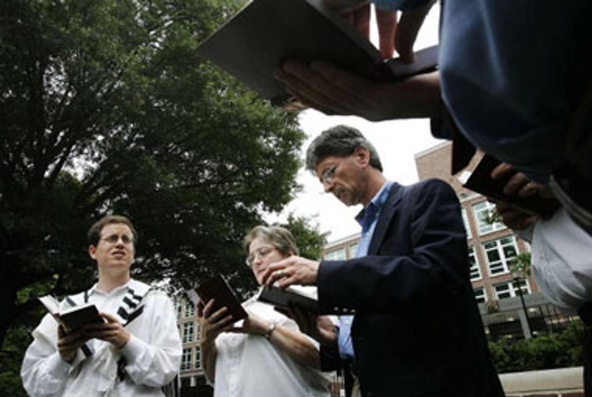 Rabbi Shmuel Herzfeld (left) of the National Synagogue leads prayer service outside the British Embassy in Washington, D.C. on July 7, 2005, in memory of the victims of the 7/7 London bombings.(Alex Wong/Getty Images)