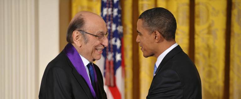 t Barack Obama shakes hands with Milton Glaser after presenting him with the 2009 National Medal of Arts in Washington, D.C., February 25, 2010.