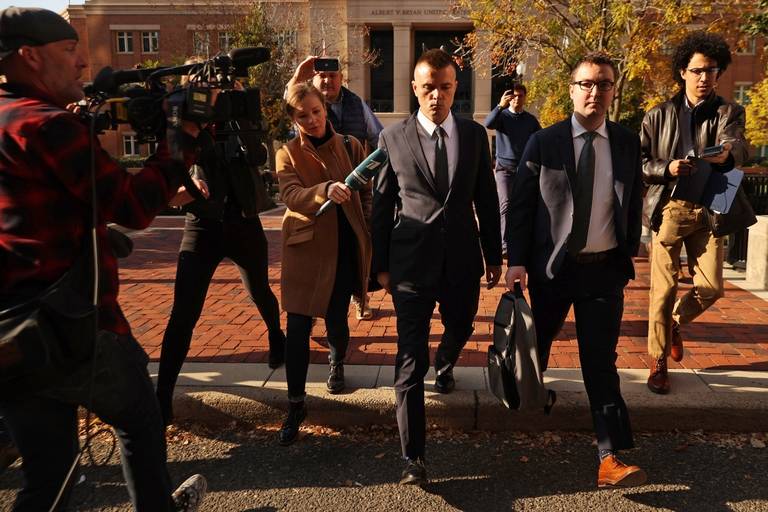 Russian analyst Igor Danchenko is pursued by journalists as he departs the Albert V. Bryan U.S. Courthouse in Alexandria, Virginia, after being arraigned on Nov. 10, 2021. Danchenko has been charged with five counts of making false statements to the FBI regarding the sources of the information he gave the British firm that created the so-called ‘Steele dossier,’ which alleged potential ties between the 2016 Trump campaign and Russia.
