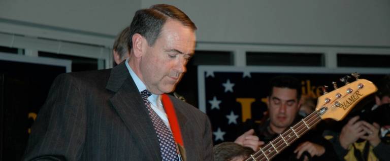 Mike Huckabee jams on his bass guitar on New Year's Eve, December 31, 2007.