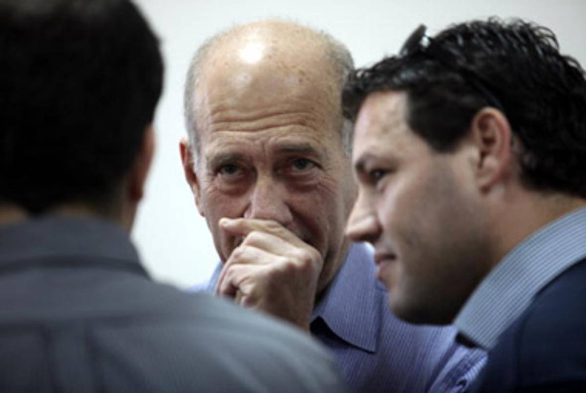 Olmert arriving in a Jerusalem court for a hearing on different graft charges last year.(Yossi Zamir/AFP/Getty Images)