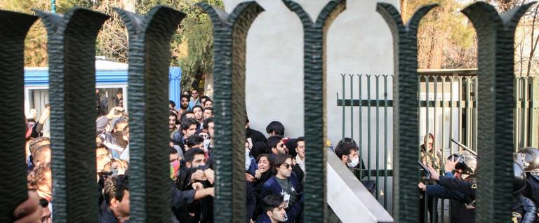 Iranian students scuffle with police at the University of Tehran on December 30, 2017.