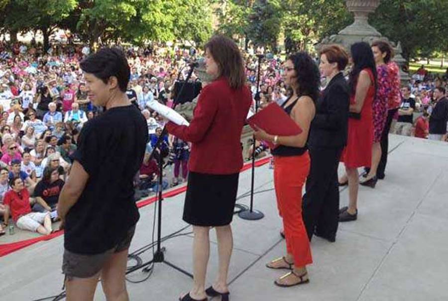 Rep. Lisa Brown (2nd from the left) reads from the Vagina Monologues on the steps of the Capitol in Lansing, Mich., on Monday, June 18, 2012.(Susan Tusa/DFP)