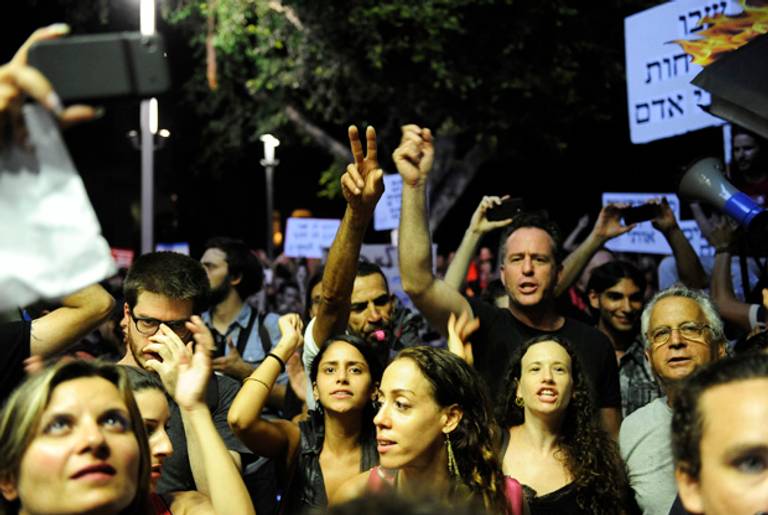 Protesters in Tel Aviv last Saturday call for universal Haredi conscription.(David Buimovitch/AFP/GettyImages)