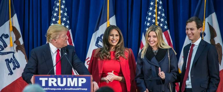 Republican presidential candidate Donald Trump (L) is joined on stage by his wife Melania Trump, daughter Ivanka Trump, and son-in-law Jared Kushner (L-R) at a campaign rally in Waterloo, Iowa, February 1, 2016. 