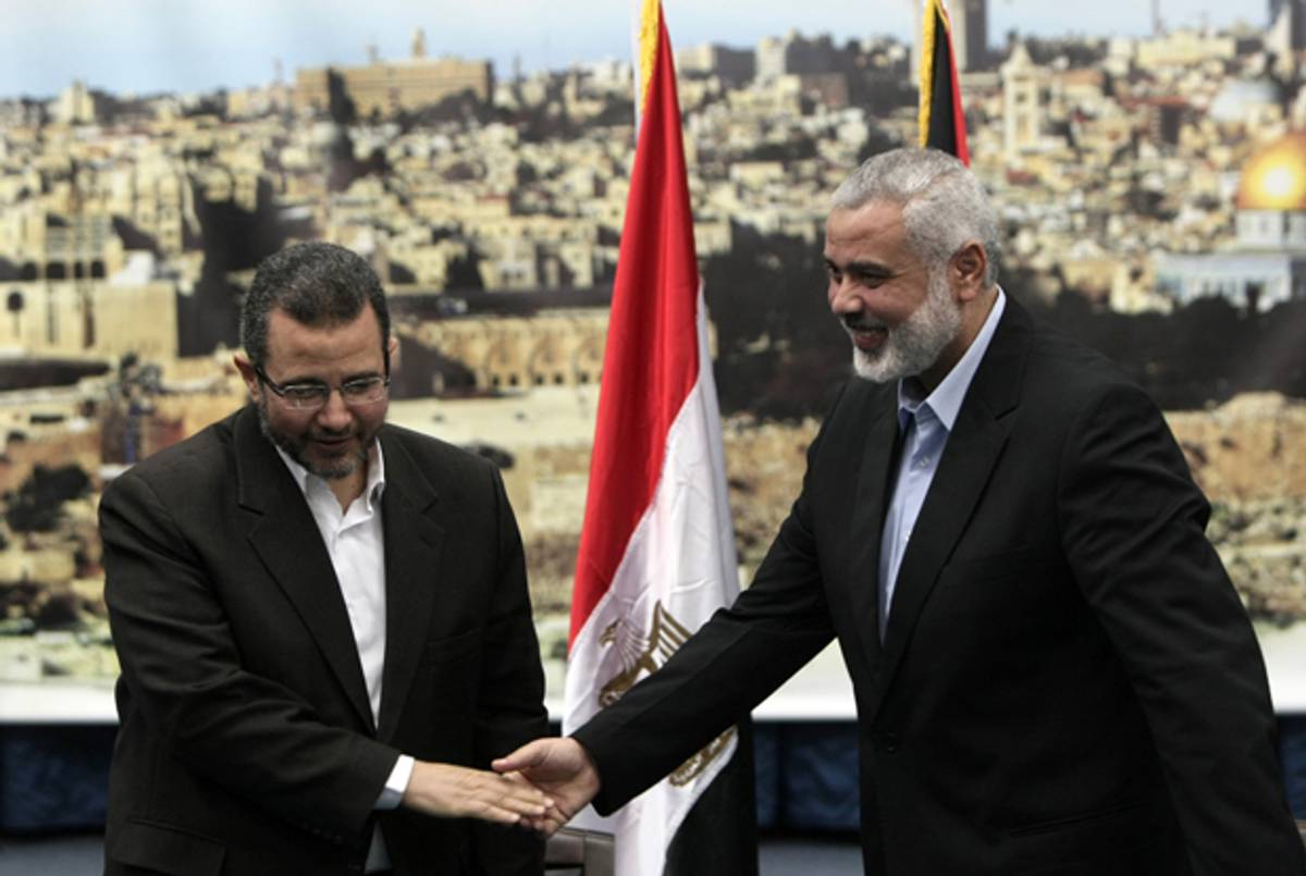 Palestinian Hamas leader in the Gaza Strip Ismail Haniya (R) receives Egyptian Prime Minister Hisham Qandil (L) in Gaza City, on November 16, 2012.(MAHMUD HAMS/AFP/Getty Images)