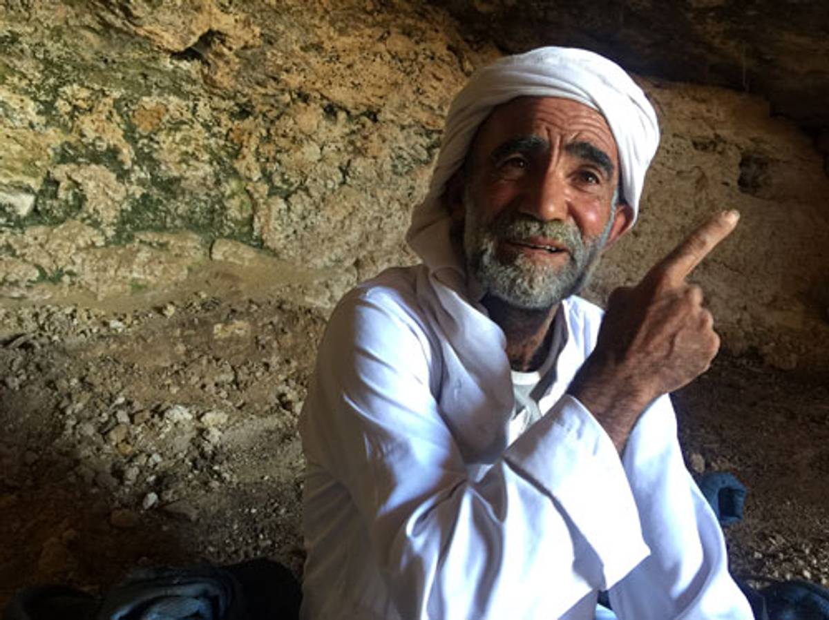 Fadhel Ammar sits in one of the caves located on his land in Sarura. (Photo: Elhanan Miller)