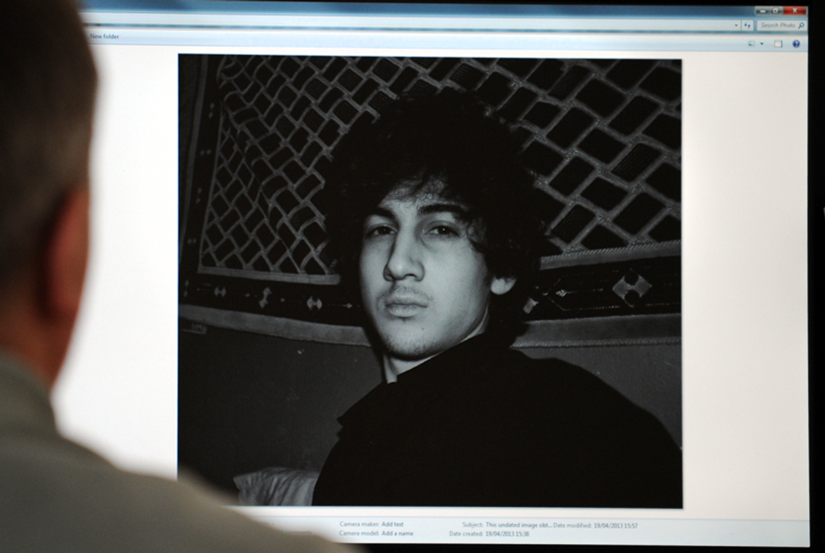 A man in Moscow looks at a computer screen displaying an undated picture the 19-year-old Dzhokhar Tsarnaev posted on his page in VKontakte, a Russian social-media site. (AFP/Getty Images)