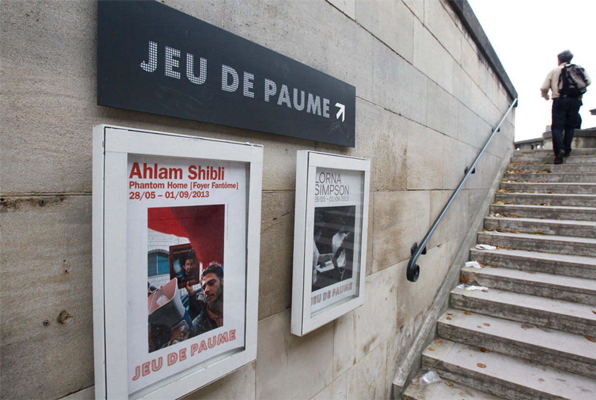 A poster of the exhibit 'Phantom Home,' by Palestinian photographer Ahlam Shibli, outside the Jeu de Paume museum in Paris, June 2013.(AP Photo/Remy de la Mauviniere)