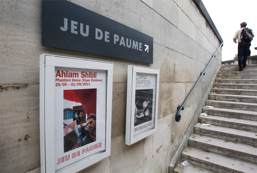 A poster of the exhibit 'Phantom Home,' by Palestinian photographer Ahlam Shibli, outside the Jeu de Paume museum in Paris, June 2013.(AP Photo/Remy de la Mauviniere)