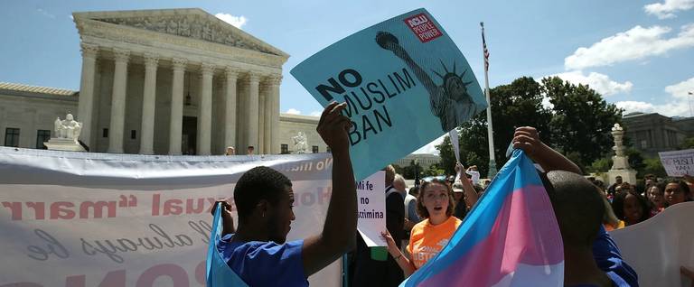 People demonstrate against U.S. President Trump's travel ban as protesters gather outside the U.S. Supreme Court following a court issued immigration ruling June 26, 2018 in Washington, DC.