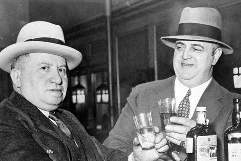 Izzy Einstein (left) and Moe Smith sharing a toast in a New York bar, 1935.