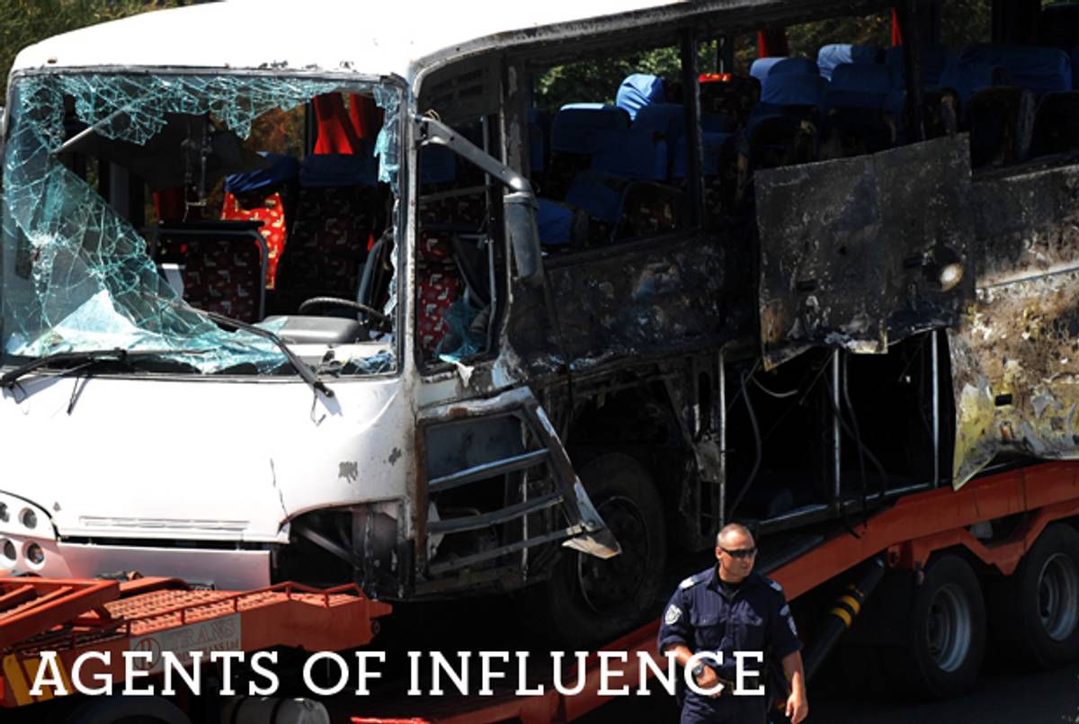A truck carries the bus damaged by the suicide bomb blast which targeted a group of Israeli tourists at the airport in Bourgas, Bulgaria, on July 19, 2012.(Nikolay Doychinov/AFP/GettyImages)