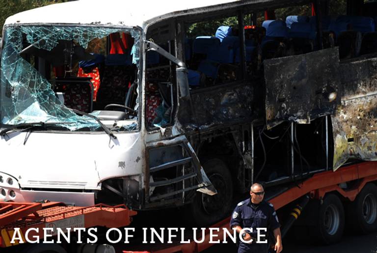 A truck carries the bus damaged by the suicide bomb blast which targeted a group of Israeli tourists at the airport in Bourgas, Bulgaria, on July 19, 2012.(Nikolay Doychinov/AFP/GettyImages)
