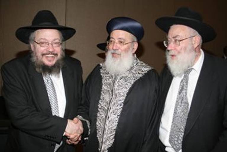 Tropper, at left, at a 2006 Eternal Jewish Family conference with Shlomo Amar, the Sephardic chief rabbi of Israel, and Nachum Eisenstein, a leading Jerusalem rabbi, in a photo on the EJF website.