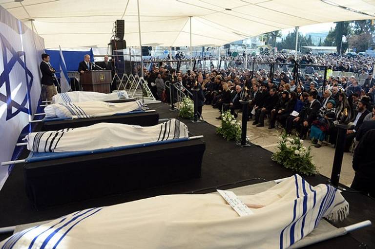 Israeli Prime Minister Benjamin Netanyahu addresses mourners at the Jerusalem funeral for the victims of the Paris terror attack. (IsraeliPM/Flickr)