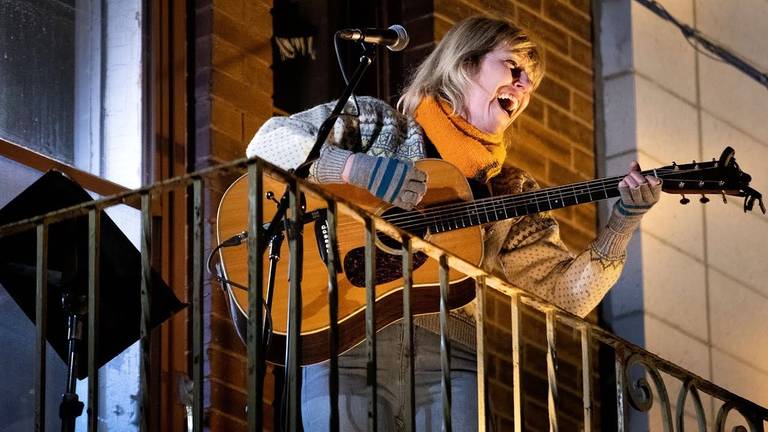 Martha Wainwright performs from her balcony in Montreal