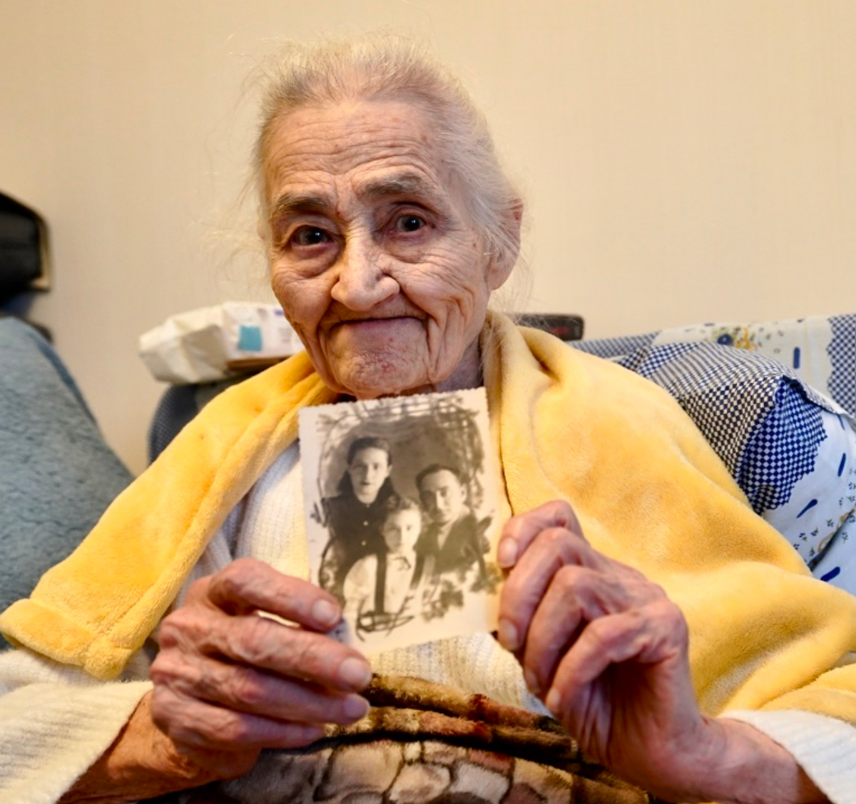 Elvira Borts shows a family photo