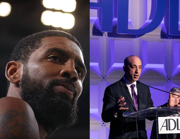 Kyrie Irving of the Brooklyn Nets (L) and CEO of the Anti-Defamation League Jonathan Greenblatt (R)