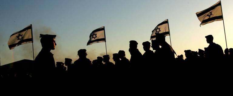 Israeli flags wave near the Gaza Strip, September 11, 2005. 