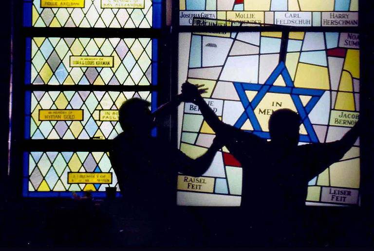 A stained-glass window by master craftsman Mark Liebowitz is installed in a synagogue