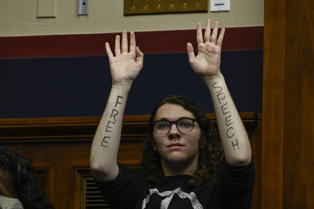 Palestinian demonstrator protests with ''free speech'' written on her arms as Northwestern, Rutgers, and UCLA Presidents to testify before the committee in the Rayburn House Office Building on Capitol Hill in Washington DC, United States on May 23, 2024.