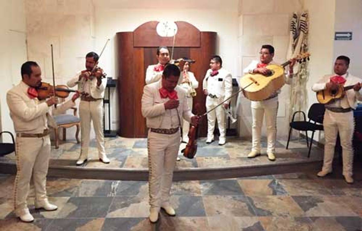 A mariachi band performs at a conversion ceremony. (Photo: Dan Lessner)