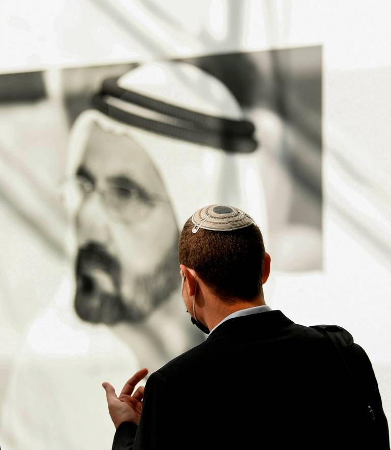 A member of an Israeli high-tech delegation stands in front of a poster of Dubai’s ruler, Sheikh Mohammed bin Rashid al-Maktoum, during a meeting with Emirati counterparts at the headquarters of the Government Accelerators in Dubai on Oct. 27, 2020