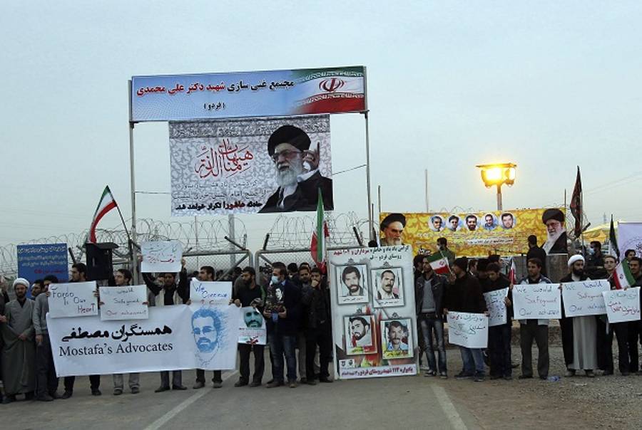 Iranian students carrying anti-US placards and portraits of the Islamic republic's supreme leader Ayatollah Ali Khamenei protest outside the Fordo Uranium Conversion Facility in Qom, in the north of the country, on November 19, 2013.(AFP/Getty)