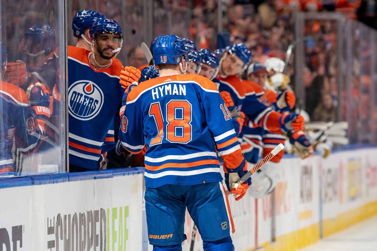 Zach Hyman celebrates his second-period goal against the Vegas Golden Knights at the bench at Rogers Place in Edmonton, Alberta, on April 10, 2024