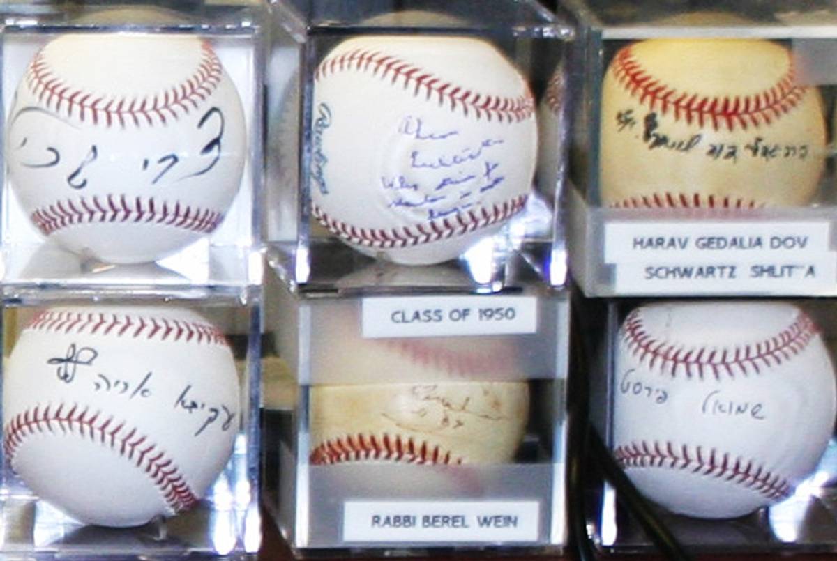 Part of Daniel Harris' prized collection of autographed baseballs.(Daniel Harris)