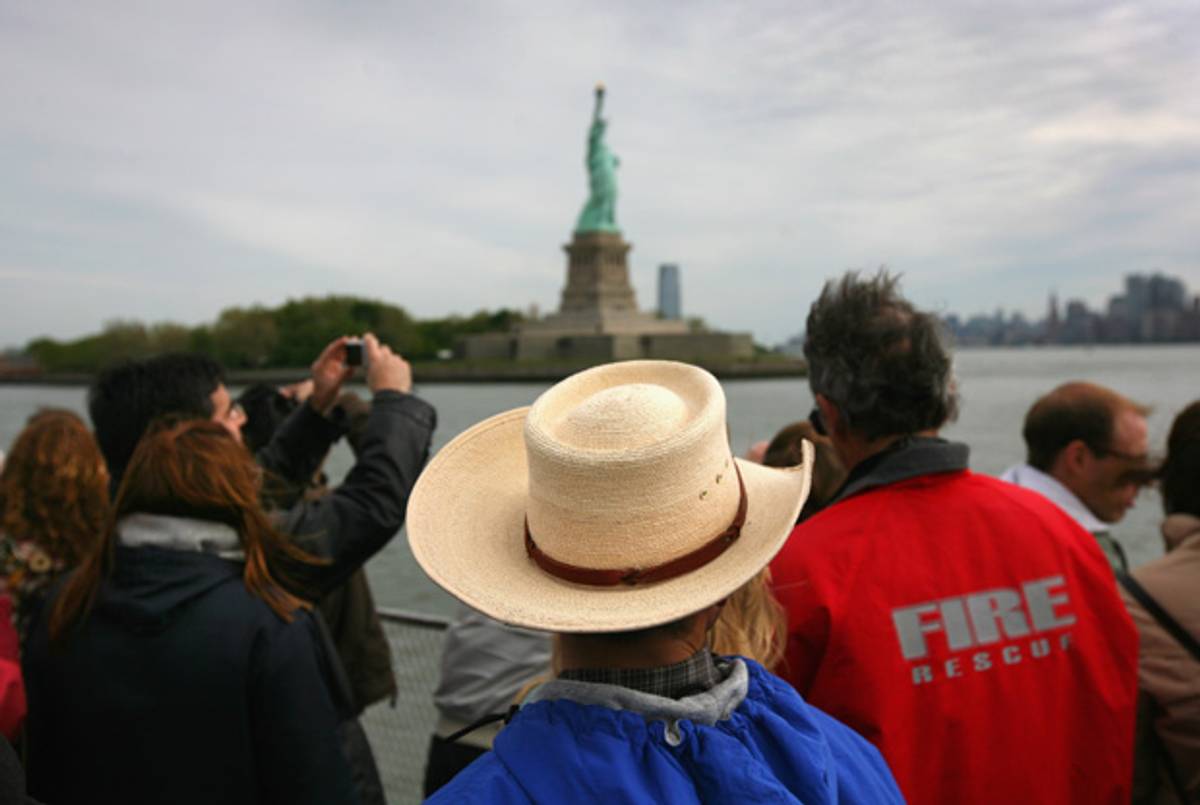 Visitors on their way to the Statue of Liberty. (John Moore/Getty Images)