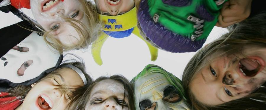 A group of children pose in costumes before trick or treating in Sydney, Australia, October 31, 2008. 
