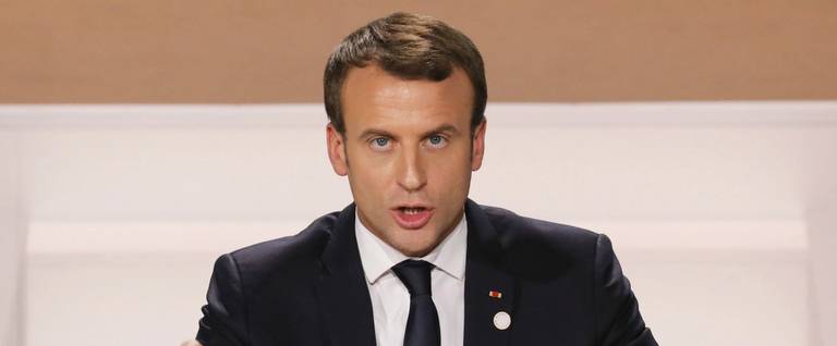 French President Emmanuel Macron delivers a speech at the One Planet Summit on December 12, 2017, at La Seine Musicale venue on l'ile Seguin in Boulogne-Billancourt, west of Paris.