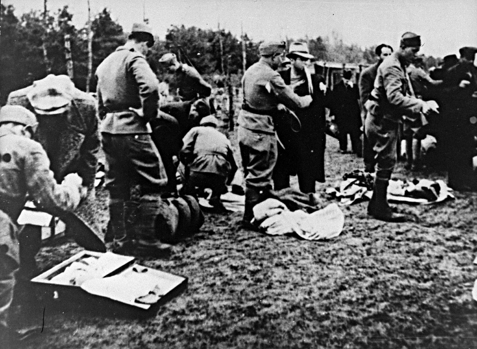 Belongings of newly arrived prisoners are seized by the Ustasha in Jasenovac. The Ustasha (Croatian Revolutionary Movement) was a fascist organization, active between 1929 and 1945.