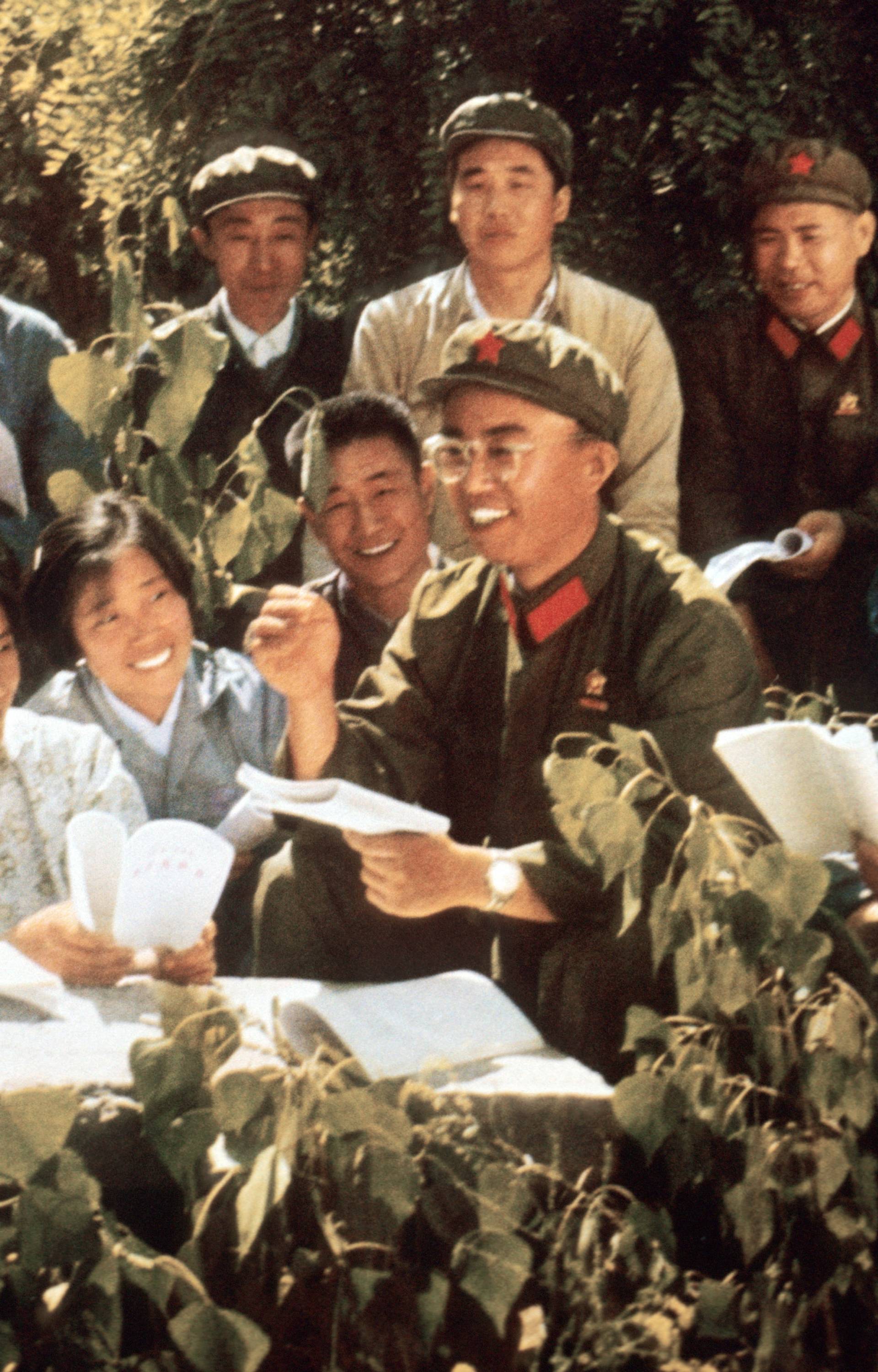 Chinese youth study with Red Guard members Mao Zedong's 'Little Red Book' somewhere in China in a picture released in 1971