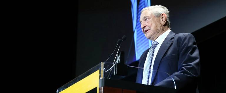 e George Soros speaks onstage at the Annual Freedom Award Benefit hosted by the International Rescue Committee at the Waldorf-Astoria hotel on November 6, 2013 in New York City. 