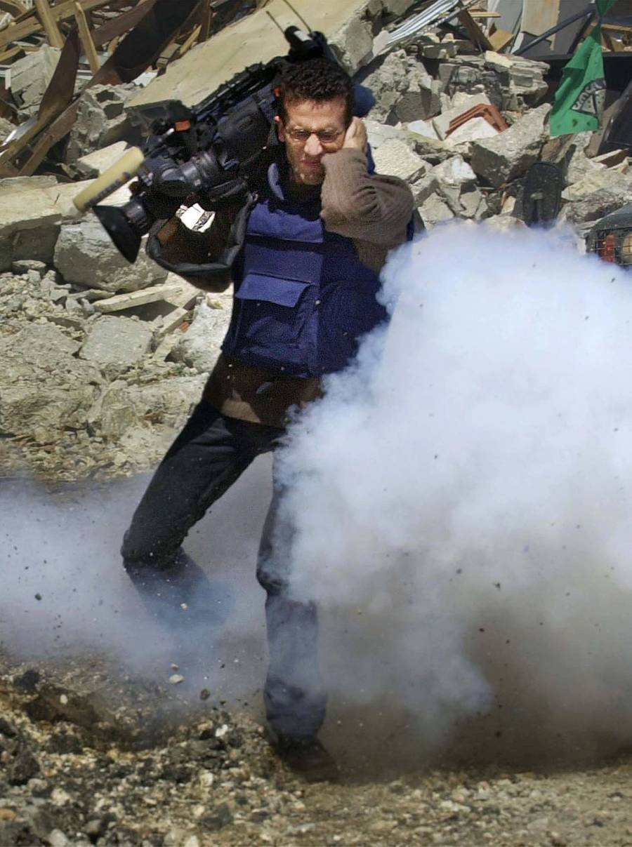 A video cameraman for the Reuters News Agency in the West Bank city of Ramallah, April, 2002
