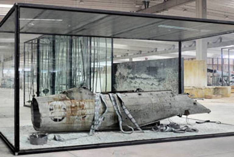 Anselm Kiefer, Merkaba, 2010. Airplane fuselage, photographs, lead, and oil, emulsion, acryclic, shellac, clay on canvas in inscribed glass and steel vitrine. 126 x 220 1/2 x 90 5/8 inches.(Copyright Anselm Kiefer. Courtesy Gagosian Gallery. Photography by Charles Duprat.)