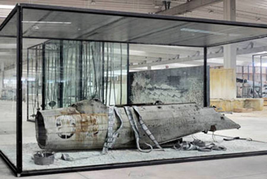 Anselm Kiefer, Merkaba, 2010. Airplane fuselage, photographs, lead, and oil, emulsion, acryclic, shellac, clay on canvas in inscribed glass and steel vitrine. 126 x 220 1/2 x 90 5/8 inches.(Copyright Anselm Kiefer. Courtesy Gagosian Gallery. Photography by Charles Duprat.)