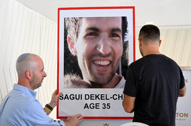 A photo of American-Israeli hostage Sagui Dekel-Chen is displayed in advance of a press conference in Tel Aviv on Oct. 10, 2023