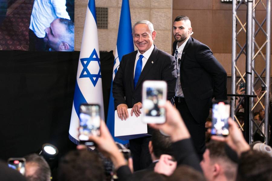 Former Israeli Prime Minister and Likud party leader Benjamin Netanyahu smiles as he enters an election night event for the Likud party in Jerusalem on Nov. 1, 2022