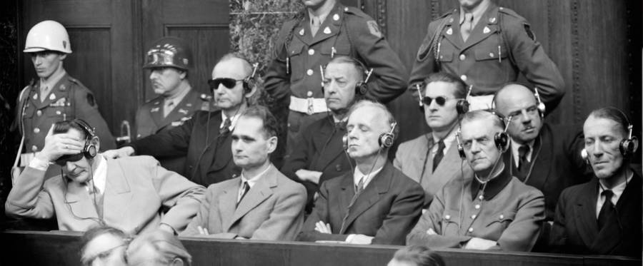 Photo taken in 1946 during the Nuremberg Trial. From L to R, first row, in the dock: Hermann Goering, Rudolf Hess, Joachim Von Ribbentrop, Wilhelm Keitel, Ernst Kaltenbrunner. Second row : Karl Doenitz, Erich Raeder, Baldur Von Schirach, Fritz Sauckel.