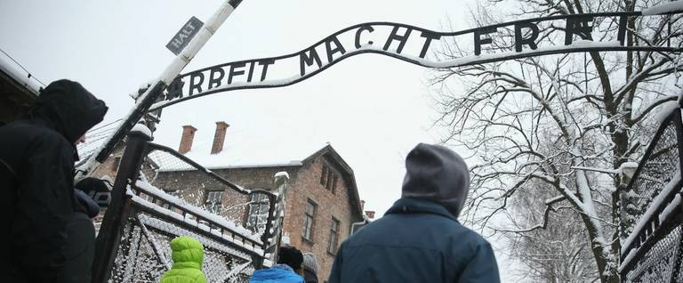 Visitors walk into Auschwitz I museum in Oswiecim, Poland, January 25, 2015. 
