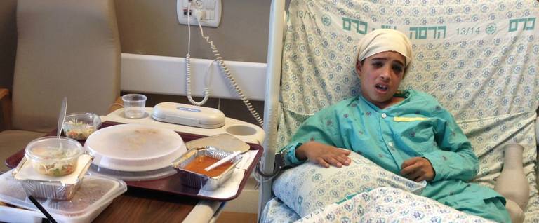 13-year-old Ahmed Manasra, who reportedly committed a stabbing attack in Pisgat Ze'ev in Jerusalem, sits in his hospital bed at the Hadassah Medical Center in Jerusalem, Israel, October 15, 2015.  