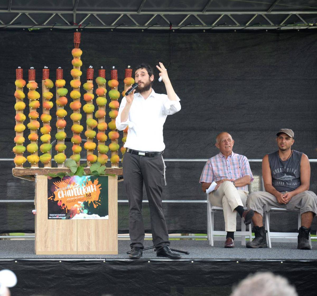 Rabbi Ari Rubin, who leads Chabad of North Queensland, and his mango menorah, Cairns, Australia, 2019