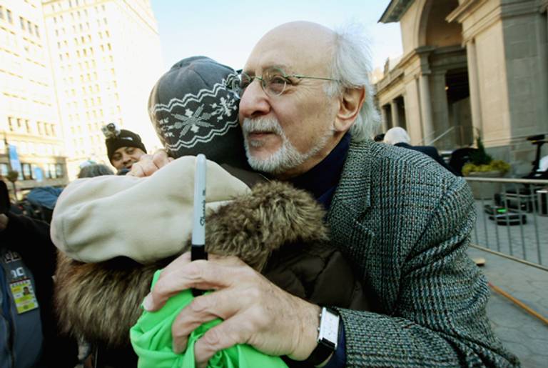 Singer Peter Yarrow, from the 1960's folk group Peter, Paul and Mary, hugs a supporter at a rally in support of the Occupy Wall Street movement on February 28, 2012 in New York City.(Mario Tama/Getty Images)
